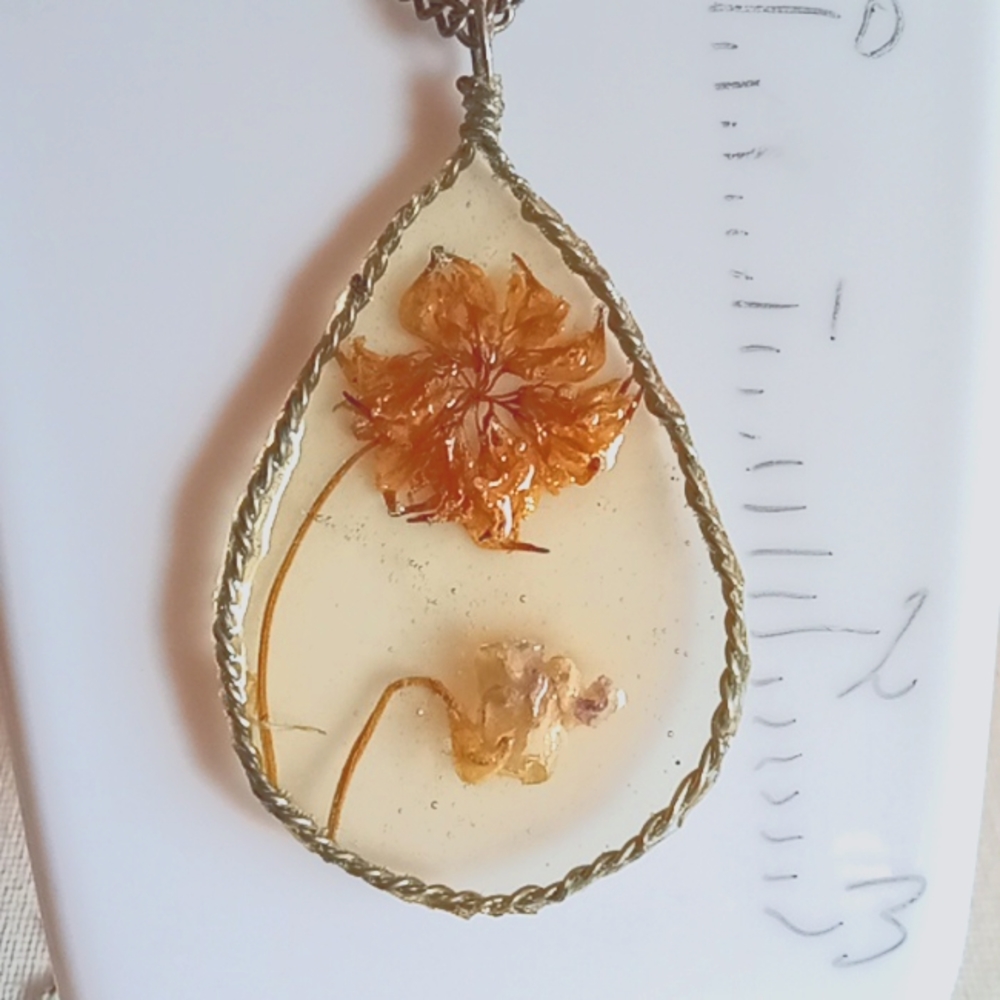 Floral necklace, amulet